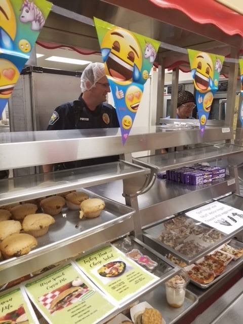 CRU Officer Porter at school serving food